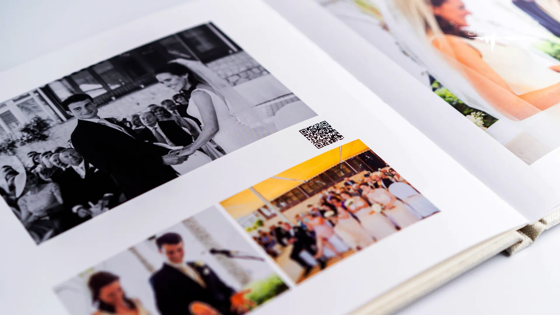 A close-up of a printed photo with a small QR Code visible in the corner.